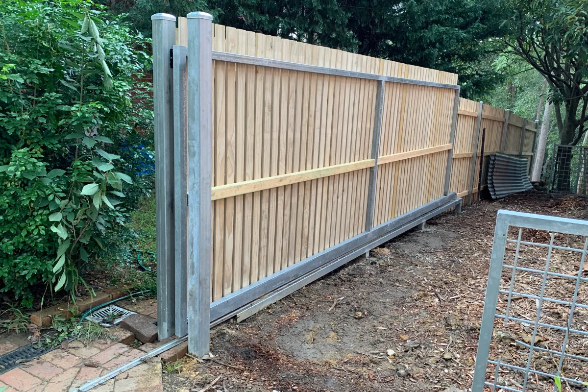 Sliding timber batten gate with galvanized steel frame